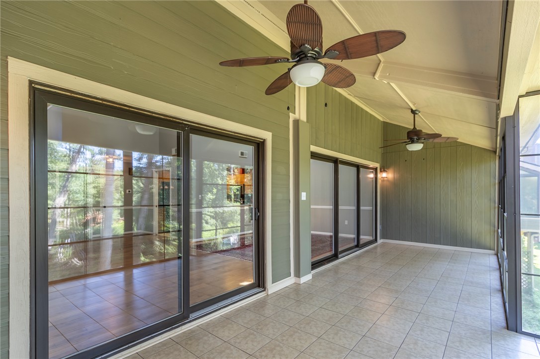 1302 Leeward Road Anderson, SC 29625 - Photo 16 of 50 An inviting screened porch, with sleek sliding glass doors and overhead fans, offers a seamless transition to the outdoors.