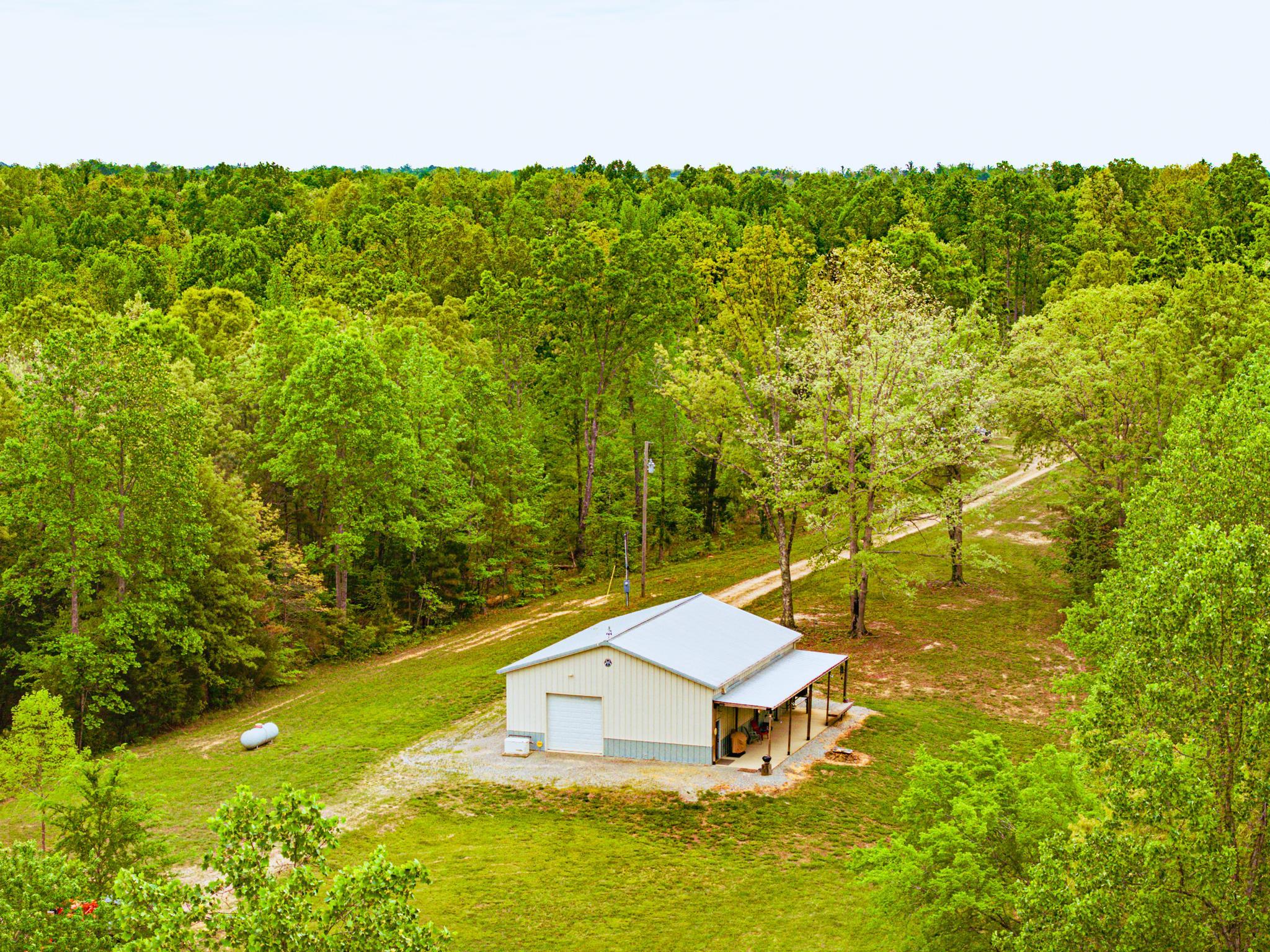 2933 Cavia Road Holladay, TN 38341 - Photo 3 of 40 a garden view with a seating space