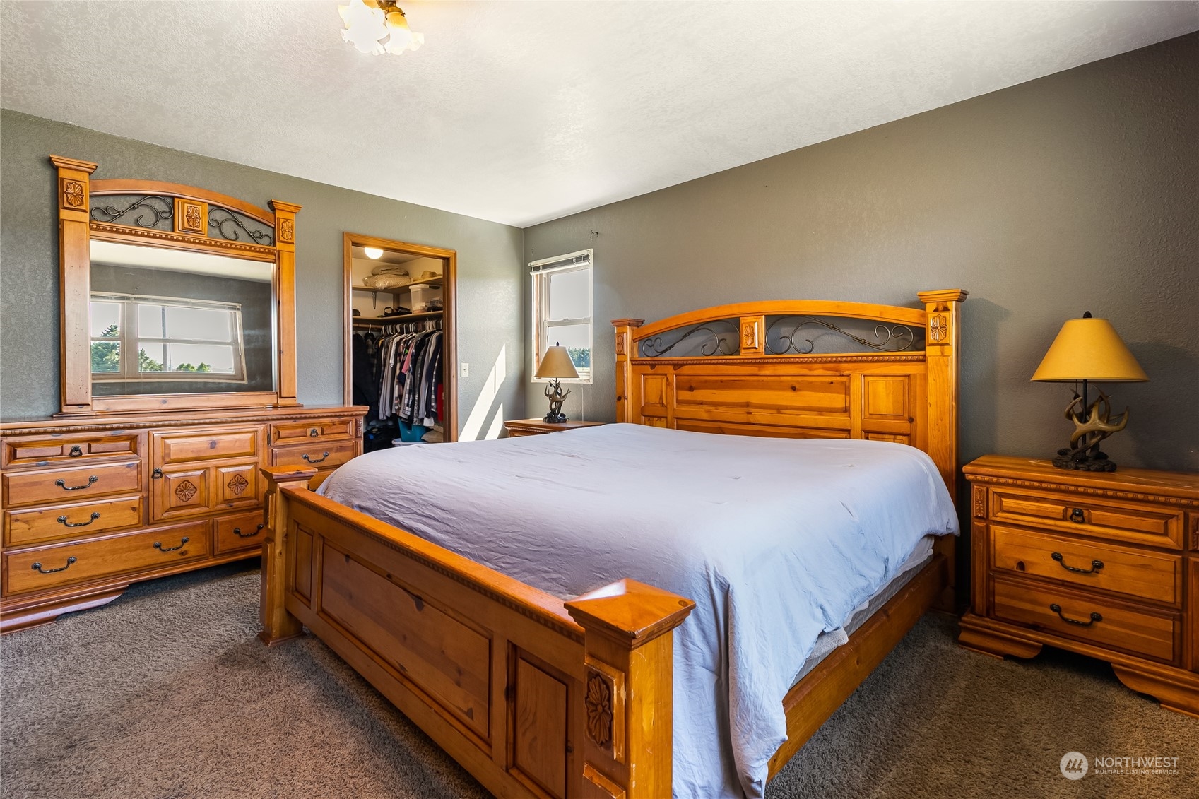 1520 East Badger Road Lynden, WA 98264 - Photo 14 of 36 a bedroom with a bed and a dresser