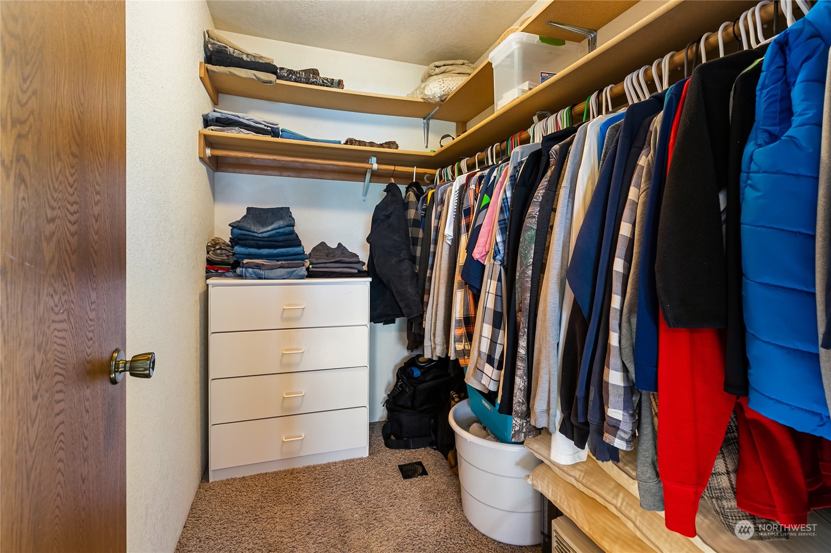 1520 East Badger Road Lynden, WA 98264 - Photo 16 of 36 a view of walk in closet with clothes and shoes