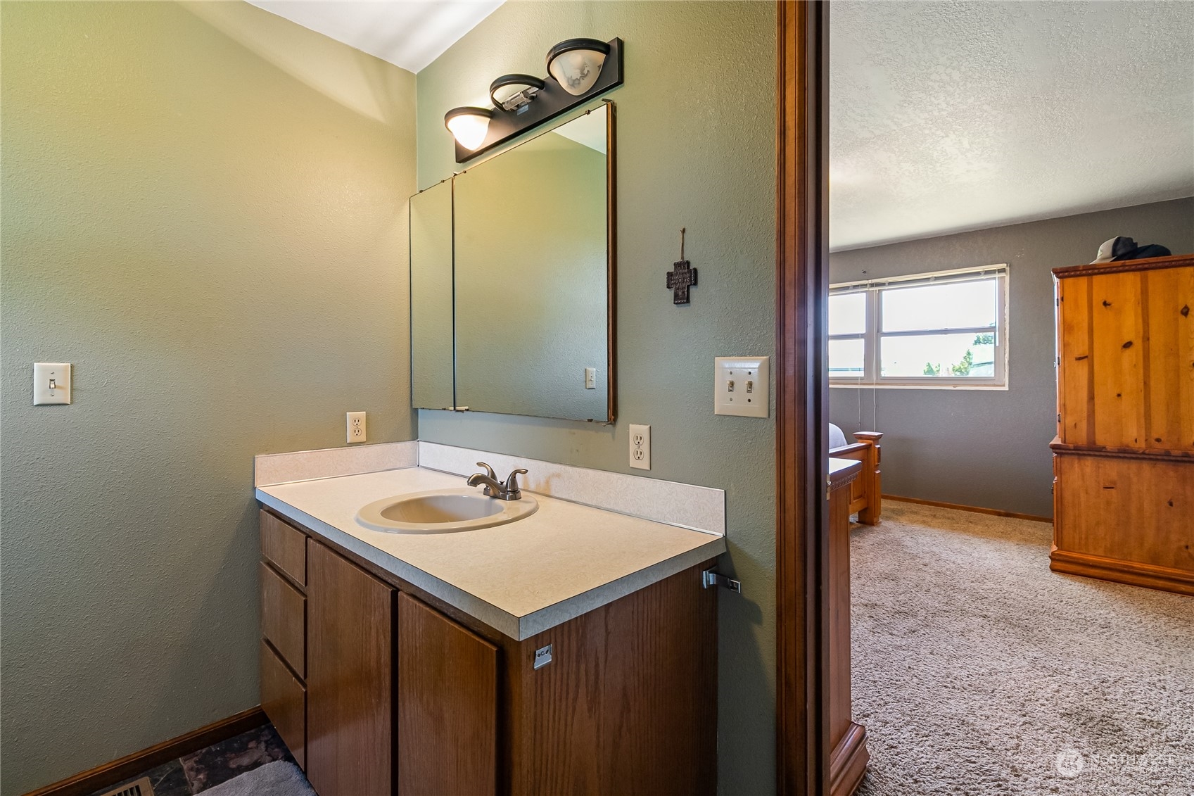 1520 East Badger Road Lynden, WA 98264 - Photo 17 of 36 a bathroom with a sink and a mirror