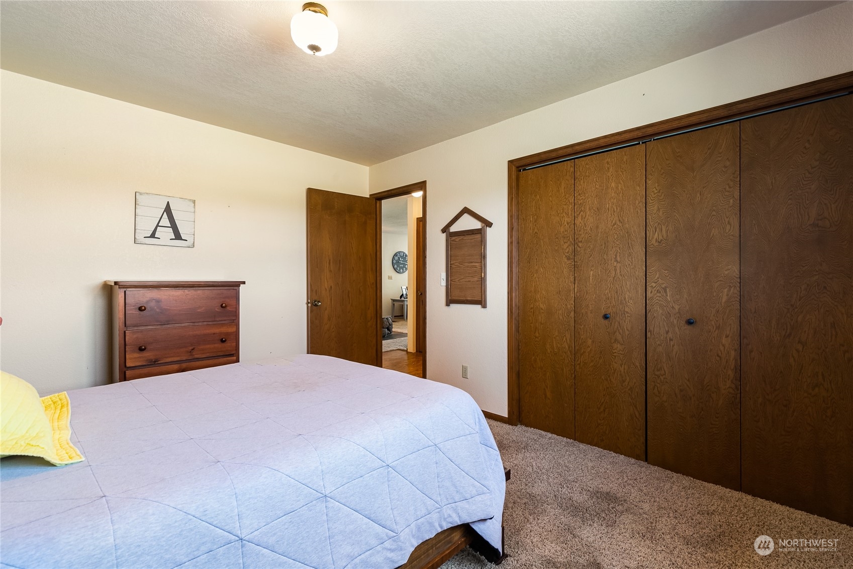 1520 East Badger Road Lynden, WA 98264 - Photo 19 of 36 a bedroom with a bed and painting on the wall