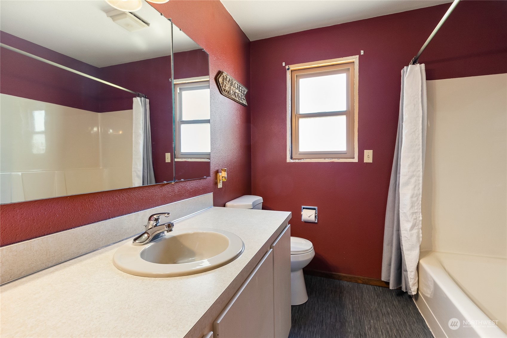 1520 East Badger Road Lynden, WA 98264 - Photo 20 of 36 a bathroom with a sink and a mirror