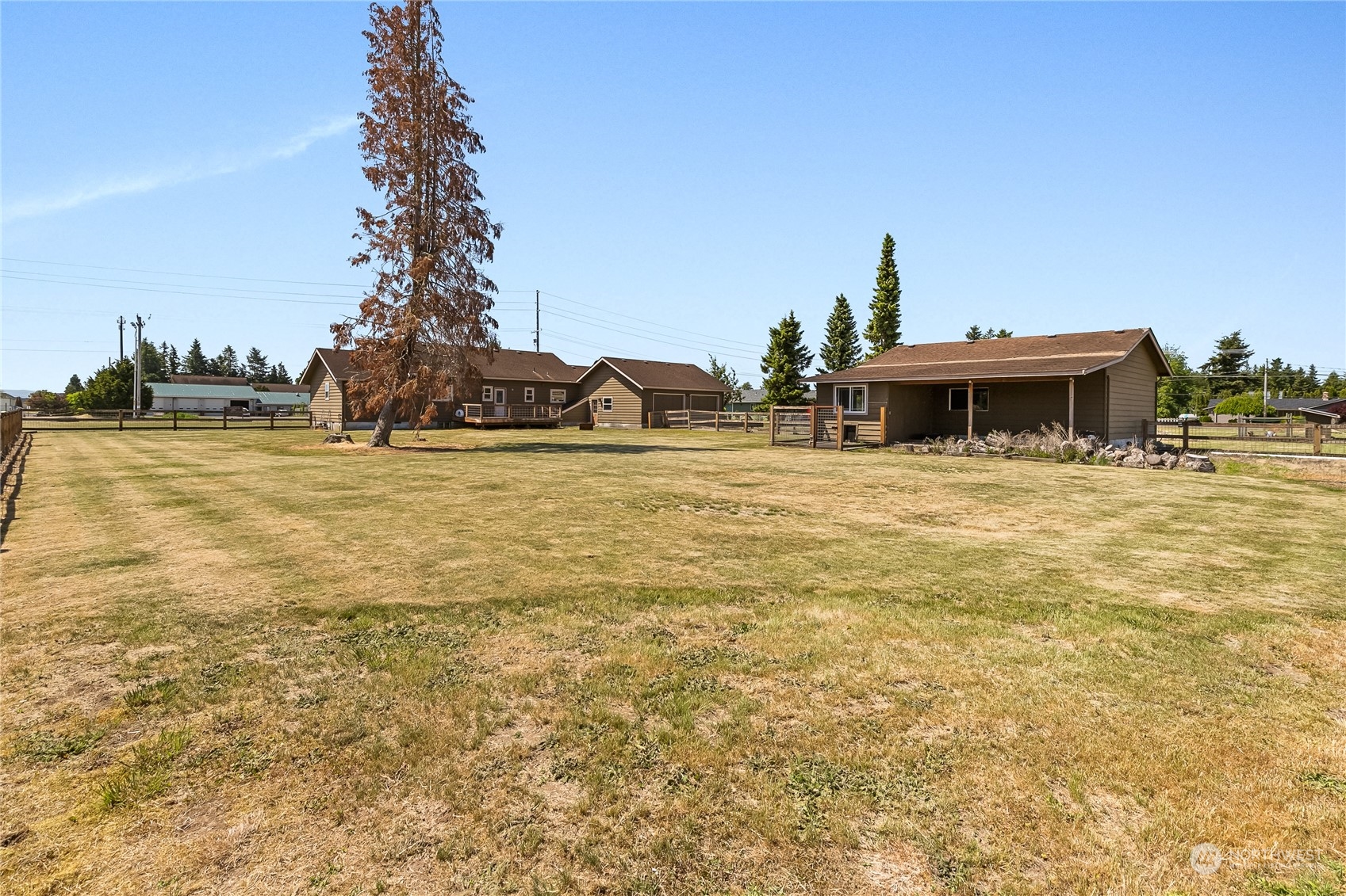 1520 East Badger Road Lynden, WA 98264 - Photo 26 of 36 a front view of a house with a yard and swimming pool