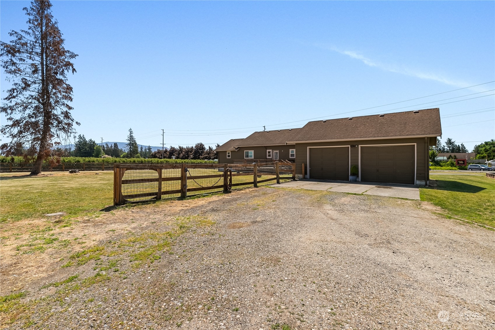 1520 East Badger Road Lynden, WA 98264 - Photo 29 of 36 a view of a house with a yard and sitting area