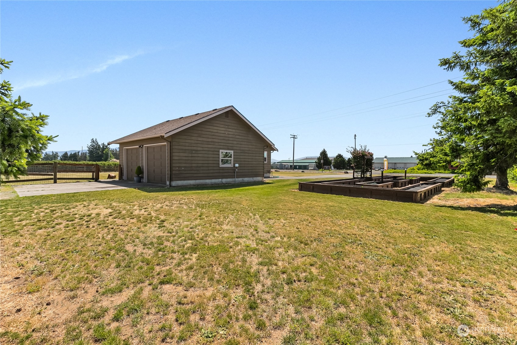 1520 East Badger Road Lynden, WA 98264 - Photo 4 of 36 a view of a swimming pool with an outdoor space and seating area