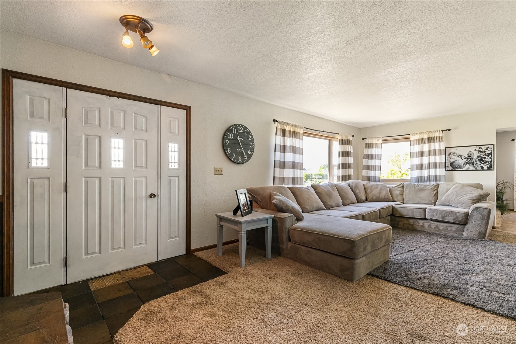1520 East Badger Road Lynden, WA 98264 - Photo 5 of 36 a living room with furniture and a large window