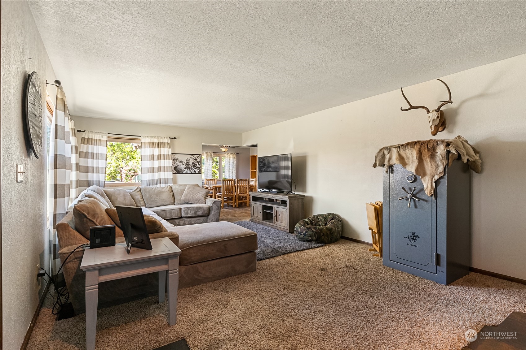 1520 East Badger Road Lynden, WA 98264 - Photo 6 of 36 a living room with furniture a couch and a window