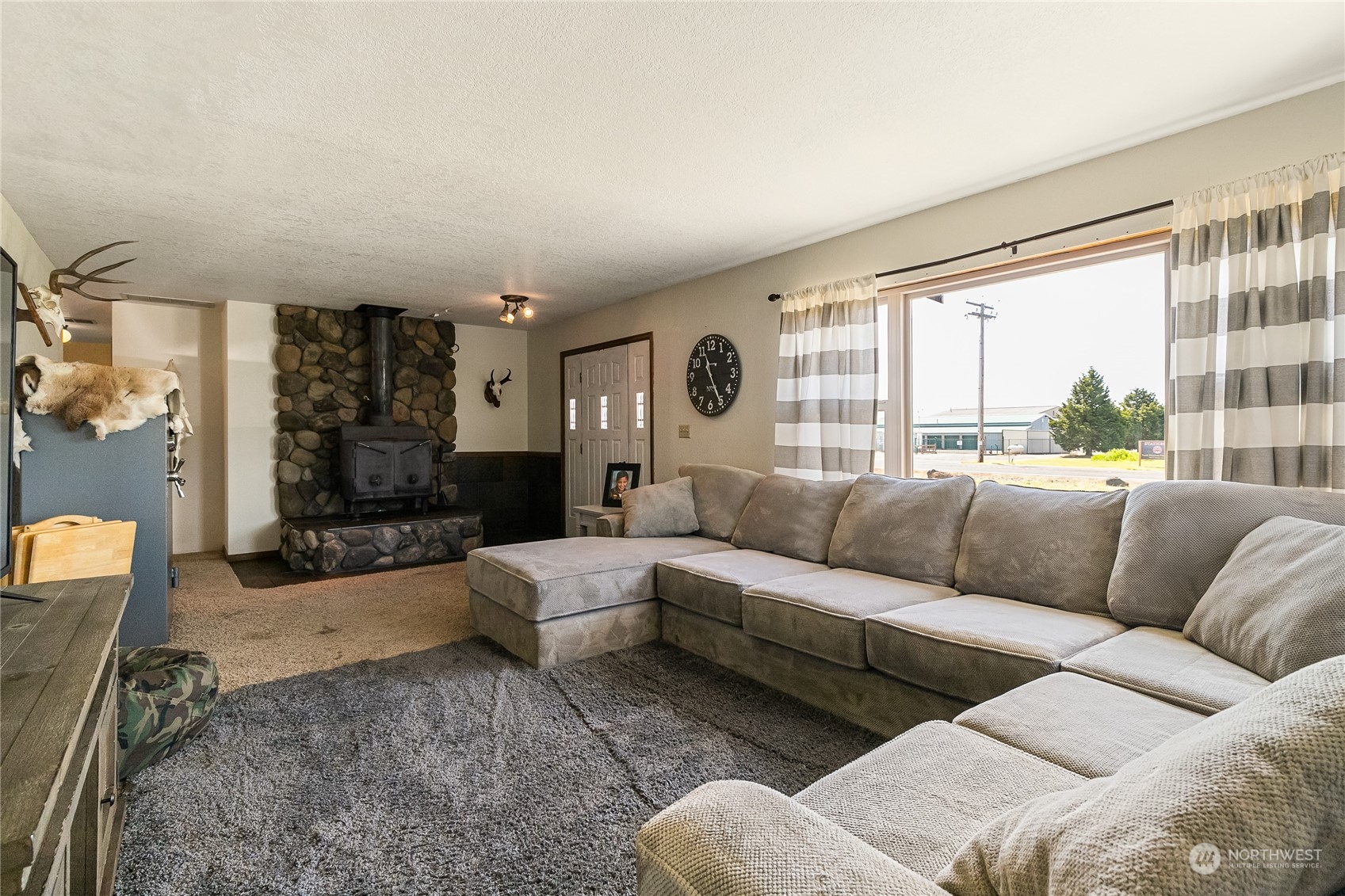 1520 East Badger Road Lynden, WA 98264 - Photo 7 of 36 a living room with furniture and a large window