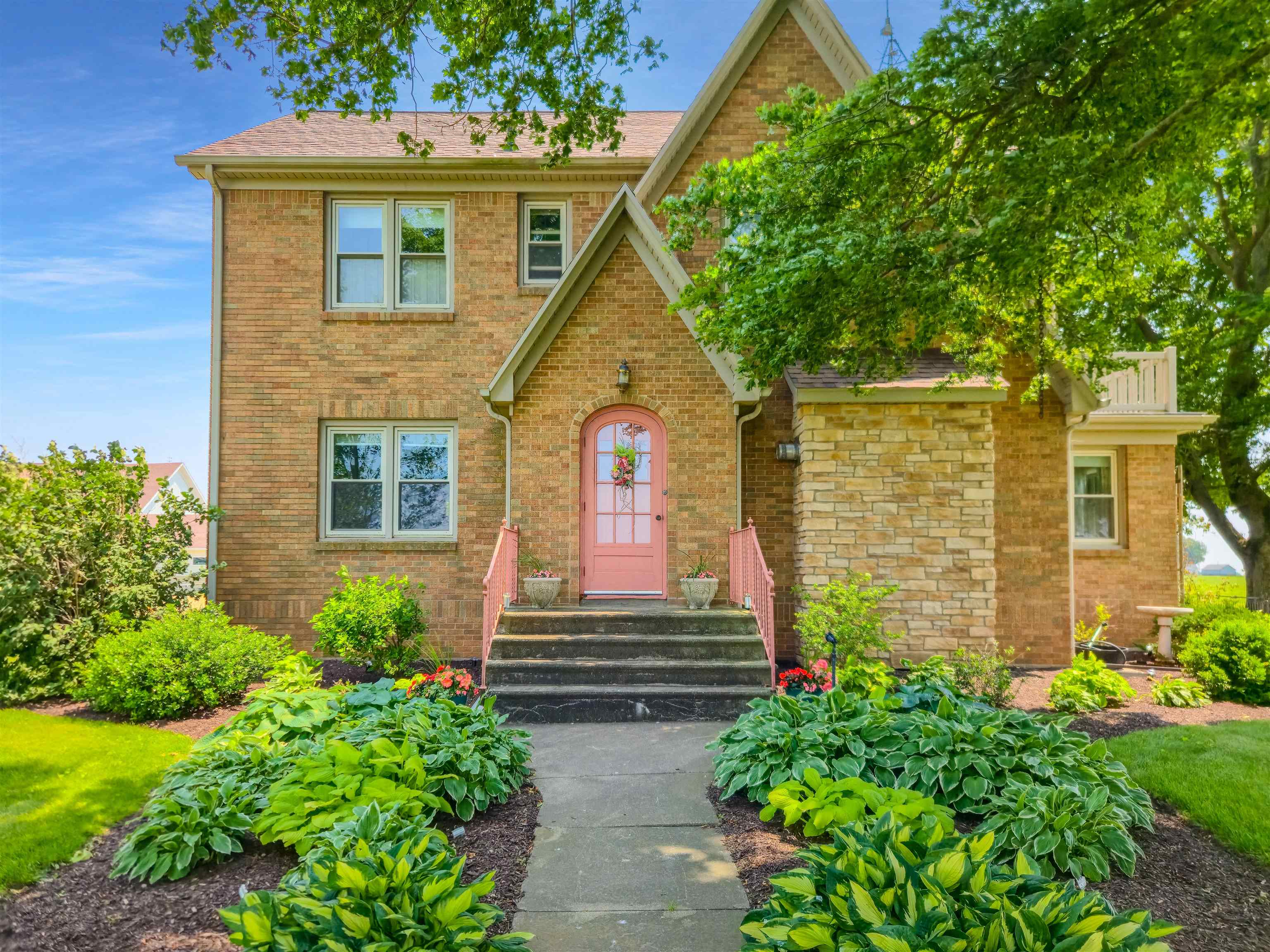 a front view of a house with garden