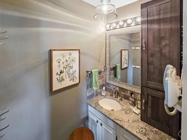 a aerial view of a house with a yard and plants