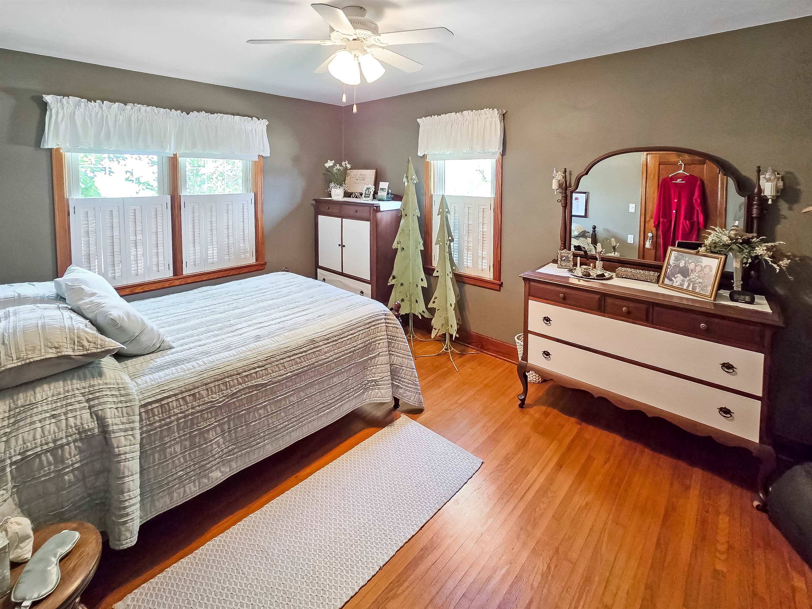 10225 North Brookville Road Shannon, IL 61078 - Photo 18 of 65 a bed room with a bed and a large dresser