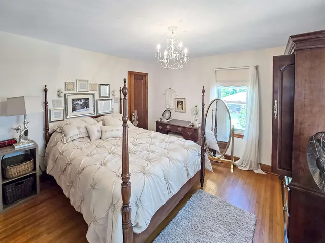 a bathroom with a tub sink a mirror and shower