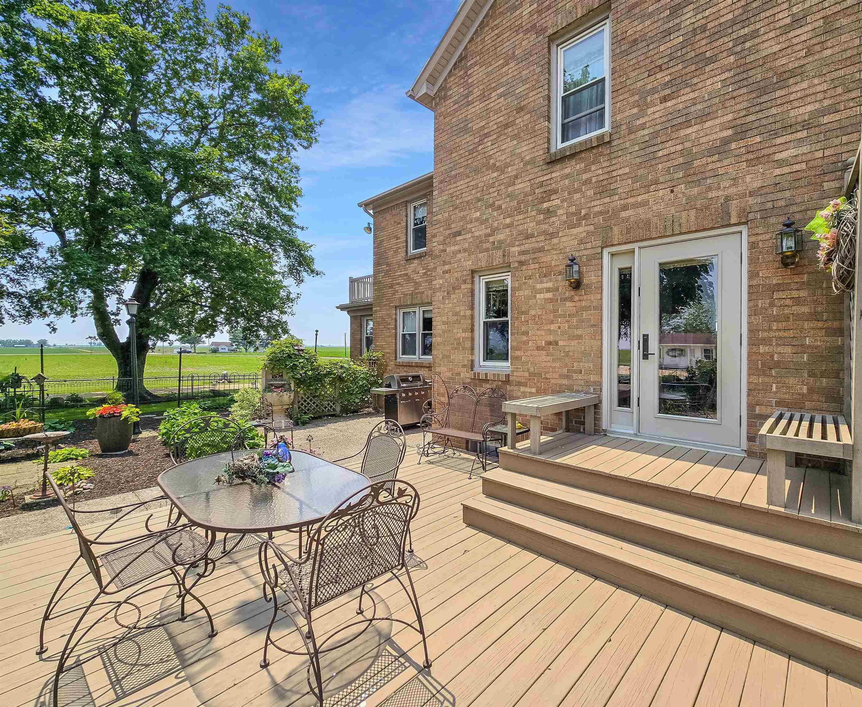 10225 North Brookville Road Shannon, IL 61078 - Photo 26 of 65 a view of a patio with table and chairs and potted plants