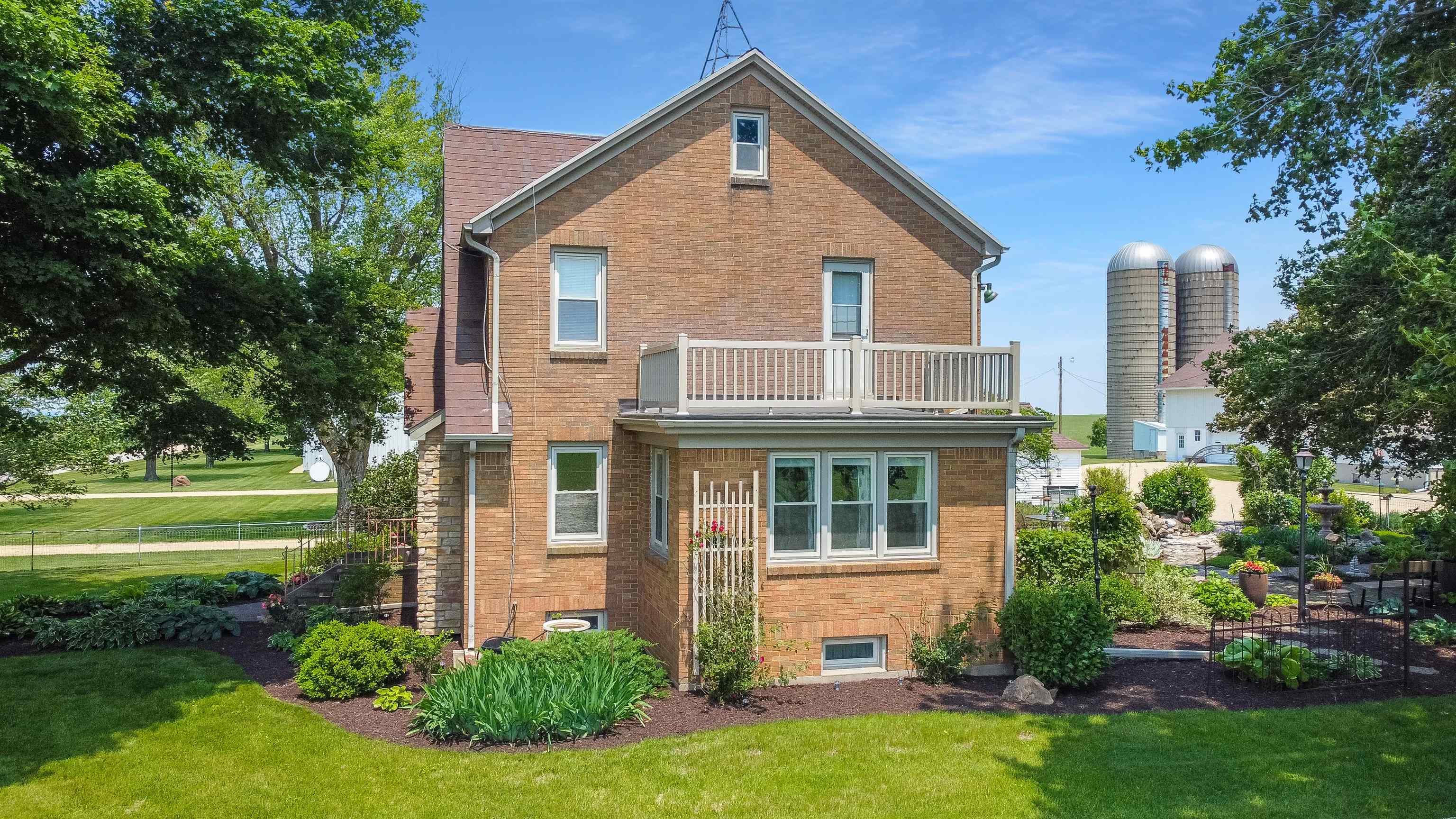 10225 North Brookville Road Shannon, IL 61078 - Photo 27 of 65 a front view of a house with a yard