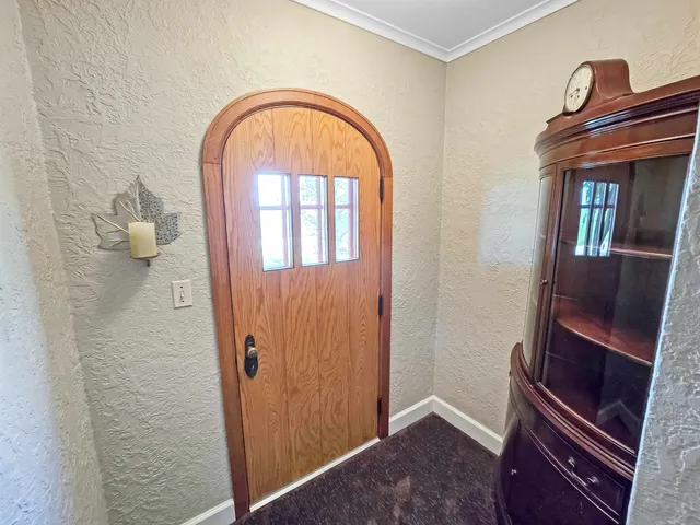 a view of an entryway with wooden floor