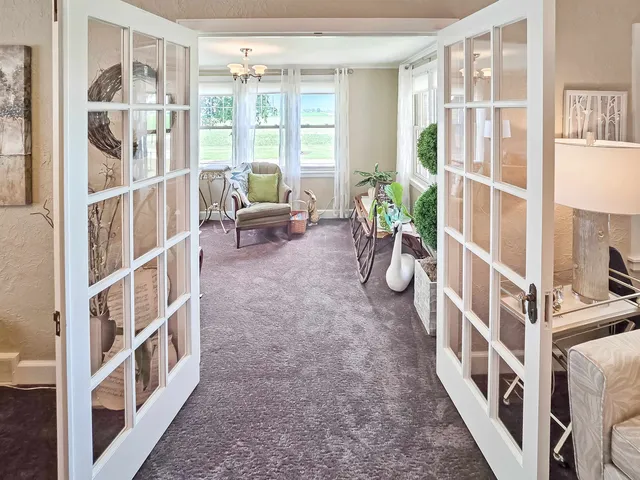 a view of an entryway with wooden floor and windows