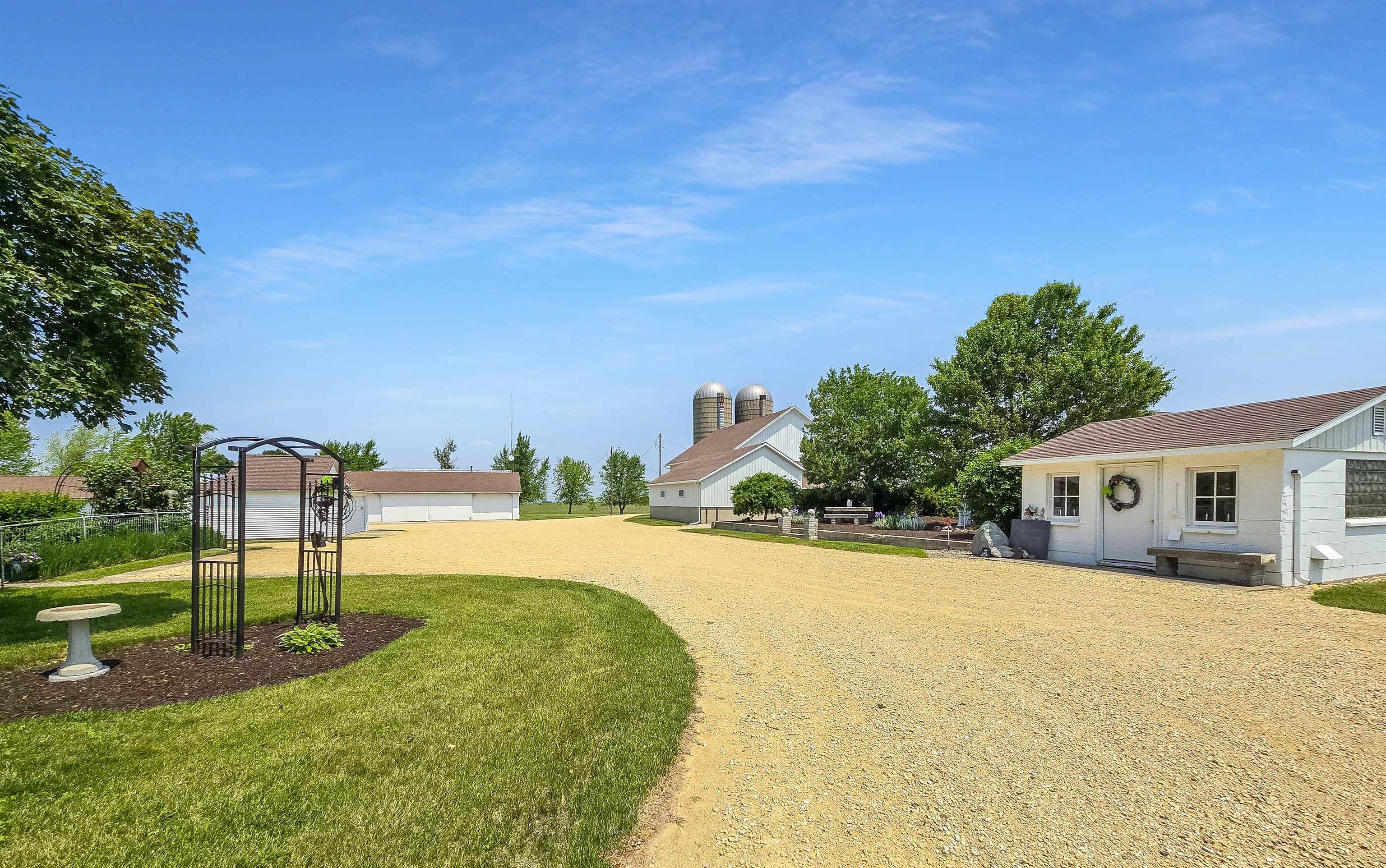 10225 North Brookville Road Shannon, IL 61078 - Photo 64 of 65 a view of a house with entertaining space and a small yard