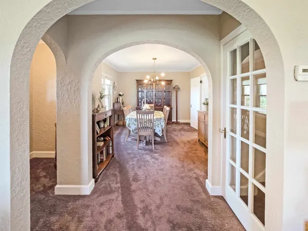 a view of a dining room with furniture window and outside view