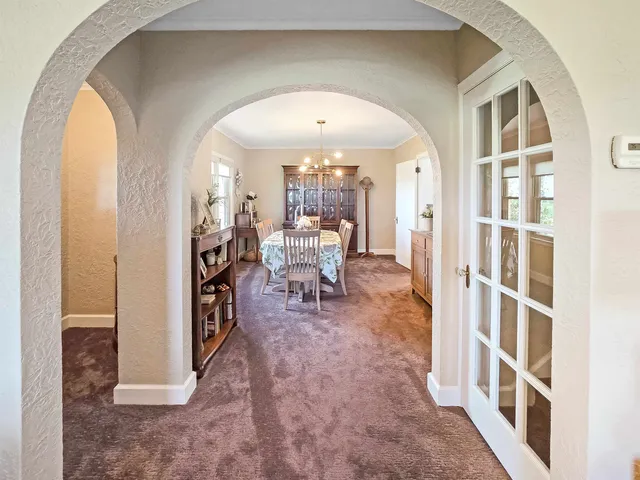 a view of a livingroom with furniture and staircase