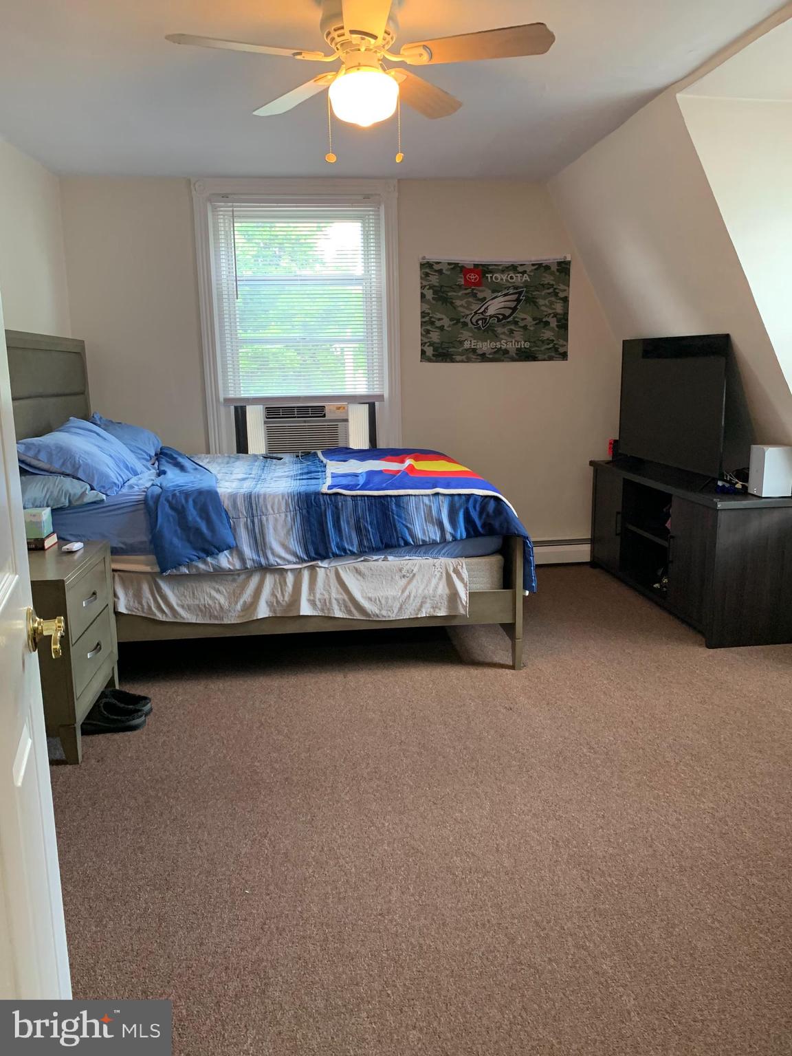 517 Walnut Street, Unit 3 Jenkintown, PA 19046 - Photo 12 of 16 a bed sitting in a room next to a window