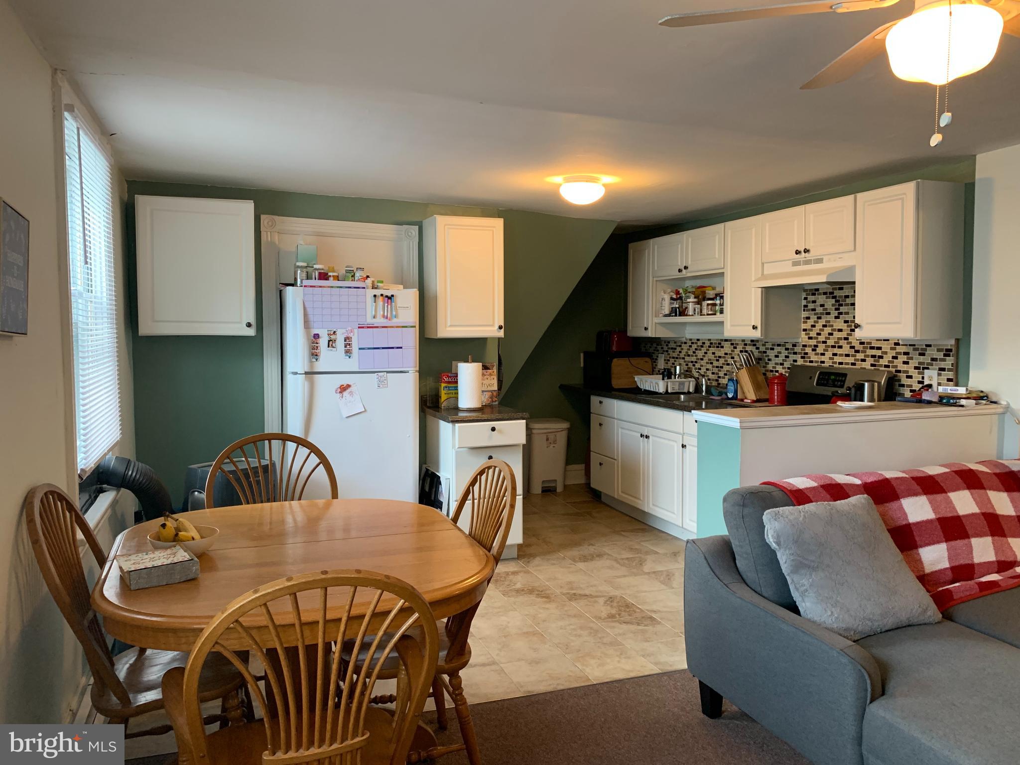 517 Walnut Street, Unit 3 Jenkintown, PA 19046 - Photo 9 of 16 a view of a dining room with furniture and a kitchen