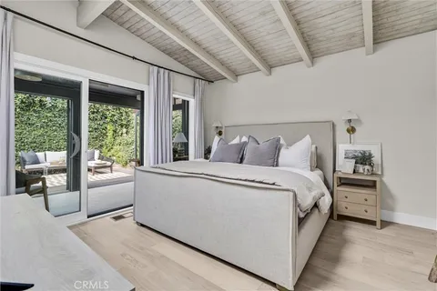 a bed room with a bed and a desk