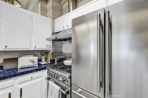 a kitchen with a sink and a stove top oven