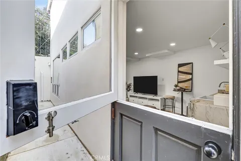 a bathroom with a granite countertop sink toilet and a mirror