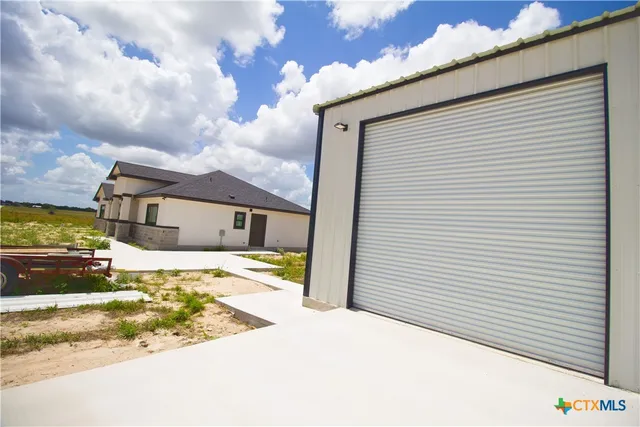 a view of a house with a snow on the road