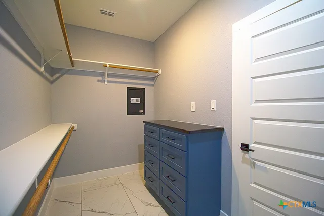 a room with closet and wooden floor