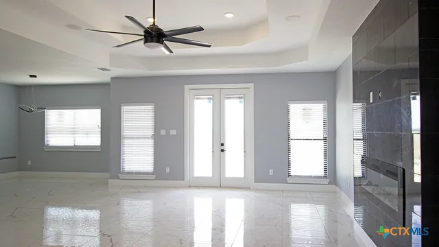 a view of an empty room with a window