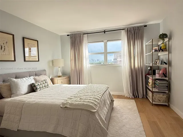 a bedroom with a bed and a walk in closet