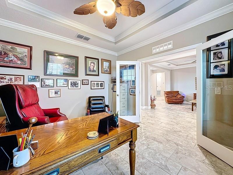 10148 Florence Ridge Drive Clermont, FL 34711 - Photo 11 of 47 a living room with furniture and flat screen tv