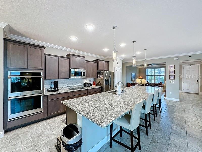 10148 Florence Ridge Drive Clermont, FL 34711 - Photo 15 of 47 a kitchen with a table and chairs in it