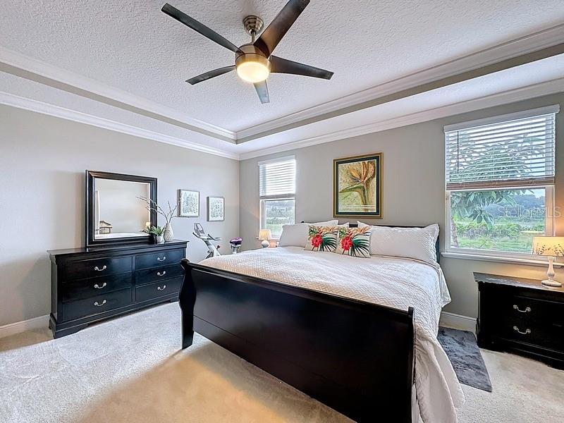 10148 Florence Ridge Drive Clermont, FL 34711 - Photo 20 of 50 a bed room with a bed and a dresser