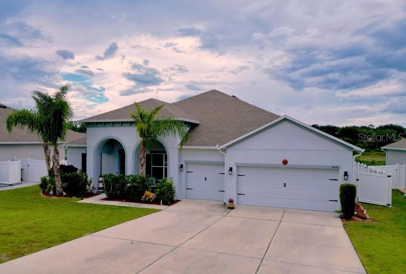 10148 Florence Ridge Drive Clermont, FL 34711 - Photo 2 of 47 a view of a house with backyard and garden
