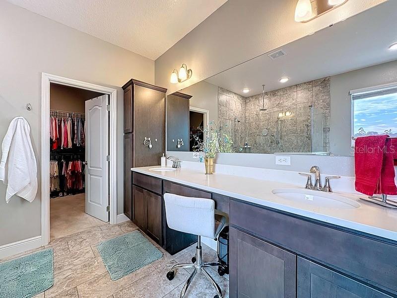 10148 Florence Ridge Drive Clermont, FL 34711 - Photo 24 of 50 a bathroom with a sink and a mirror