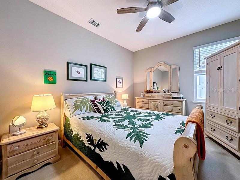 10148 Florence Ridge Drive Clermont, FL 34711 - Photo 31 of 47 a bedroom with a bed and wooden floor