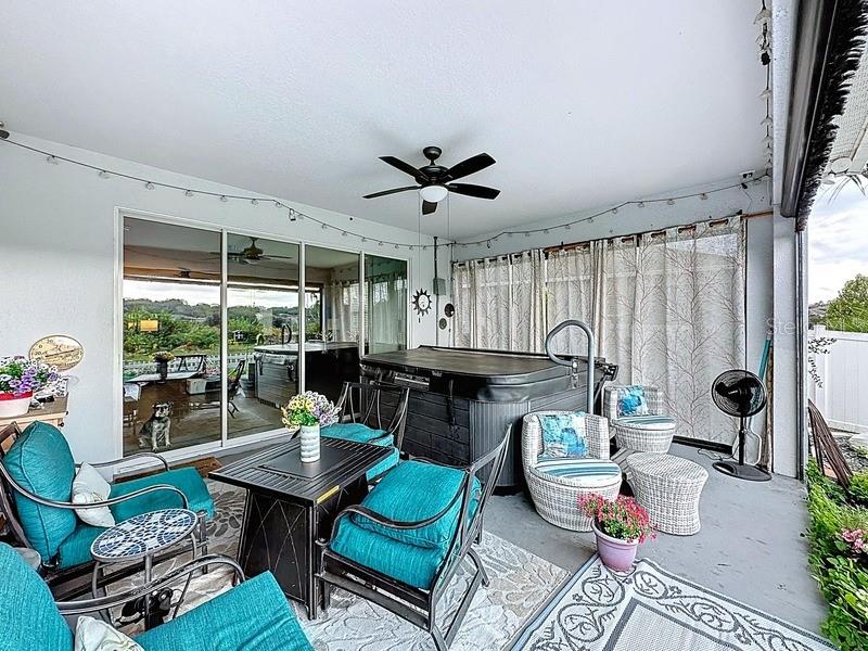10148 Florence Ridge Drive Clermont, FL 34711 - Photo 38 of 50 a living room with furniture a table and a large window