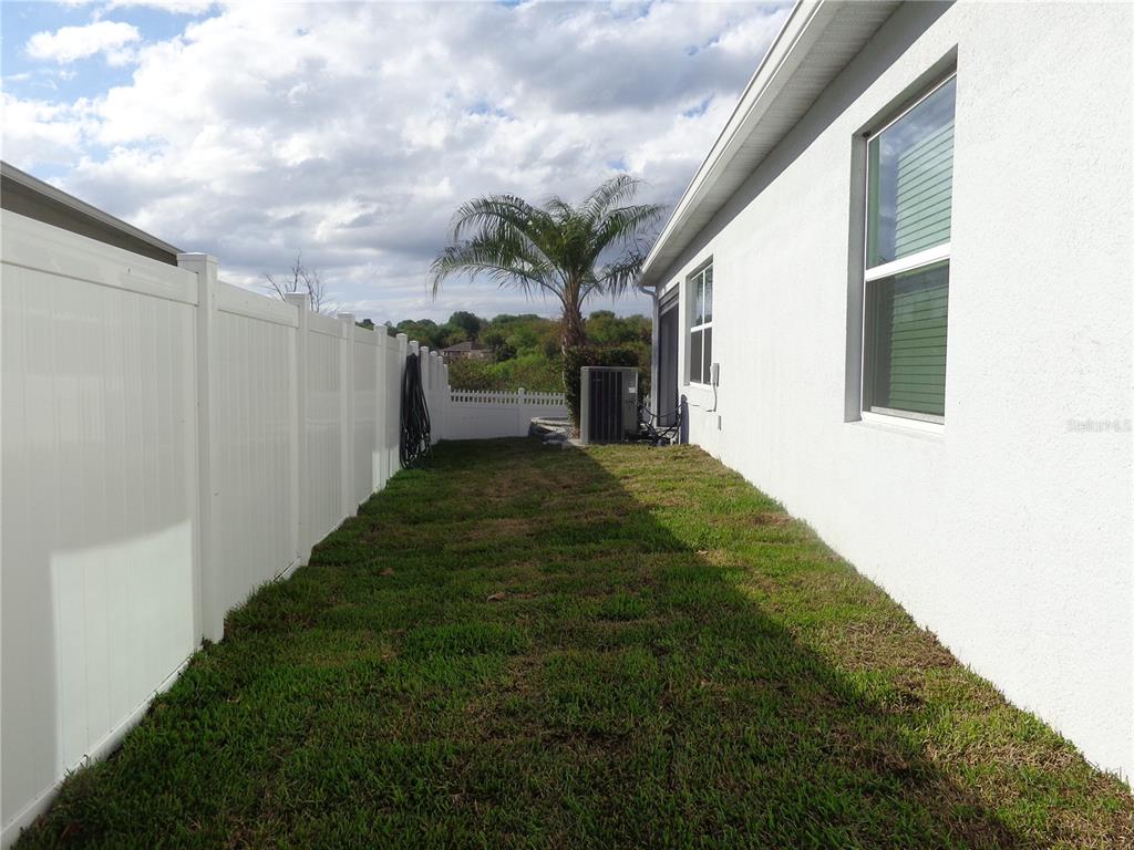 10148 Florence Ridge Drive Clermont, FL 34711 - Photo 42 of 50 a view of a backyard with garden