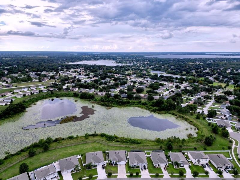 10148 Florence Ridge Drive Clermont, FL 34711 - Photo 44 of 47 an aerial view of residential houses with outdoor space