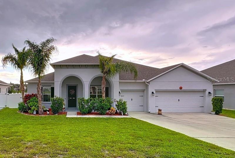 10148 Florence Ridge Drive Clermont, FL 34711 - Photo 46 of 47 a front view of house with yard and green space