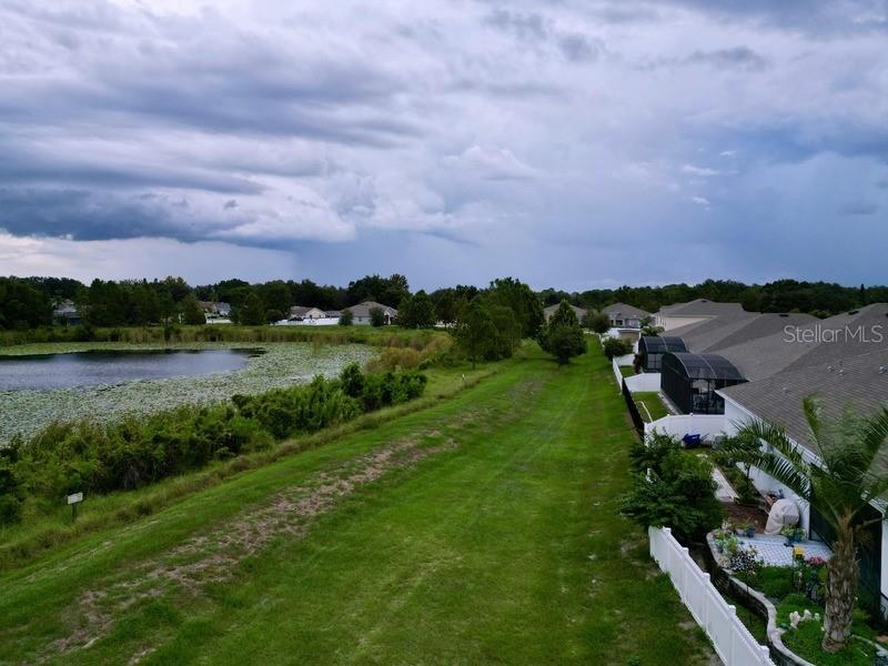 10148 Florence Ridge Drive Clermont, FL 34711 - Photo 48 of 50 a view of a lake with houses in back