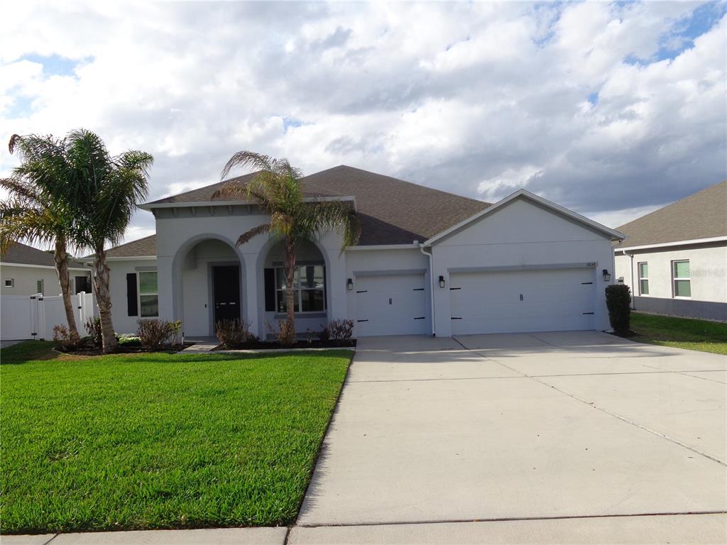 10148 Florence Ridge Drive Clermont, FL 34711 - Photo 50 of 50 a front view of house with yard and green space