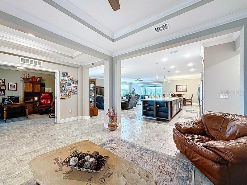 10148 Florence Ridge Drive Clermont, FL 34711 - Photo 5 of 47 a living room with furniture and a view of kitchen