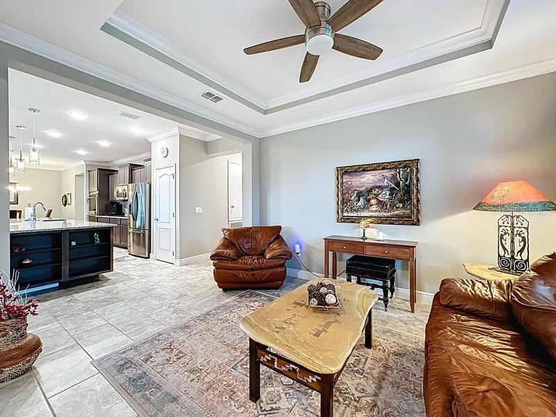 10148 Florence Ridge Drive Clermont, FL 34711 - Photo 6 of 47 a living room with furniture and a fireplace