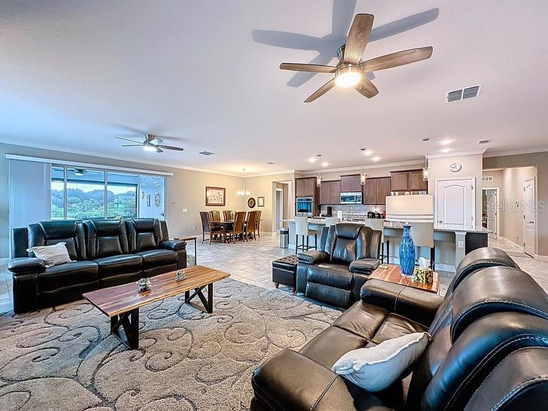 10148 Florence Ridge Drive Clermont, FL 34711 - Photo 10 of 47 a living room with furniture and a large window