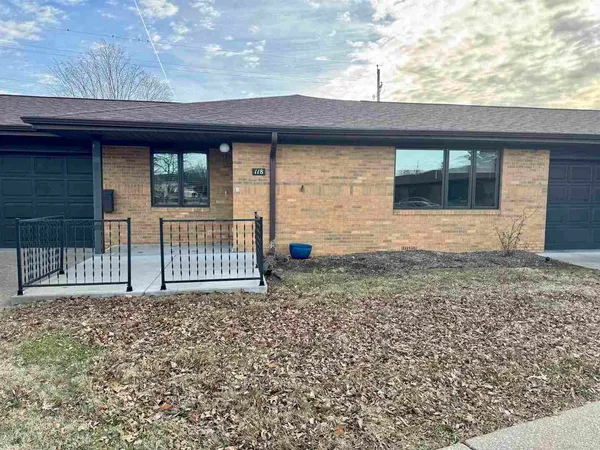 a view of a house with a small yard and wooden floor and fence