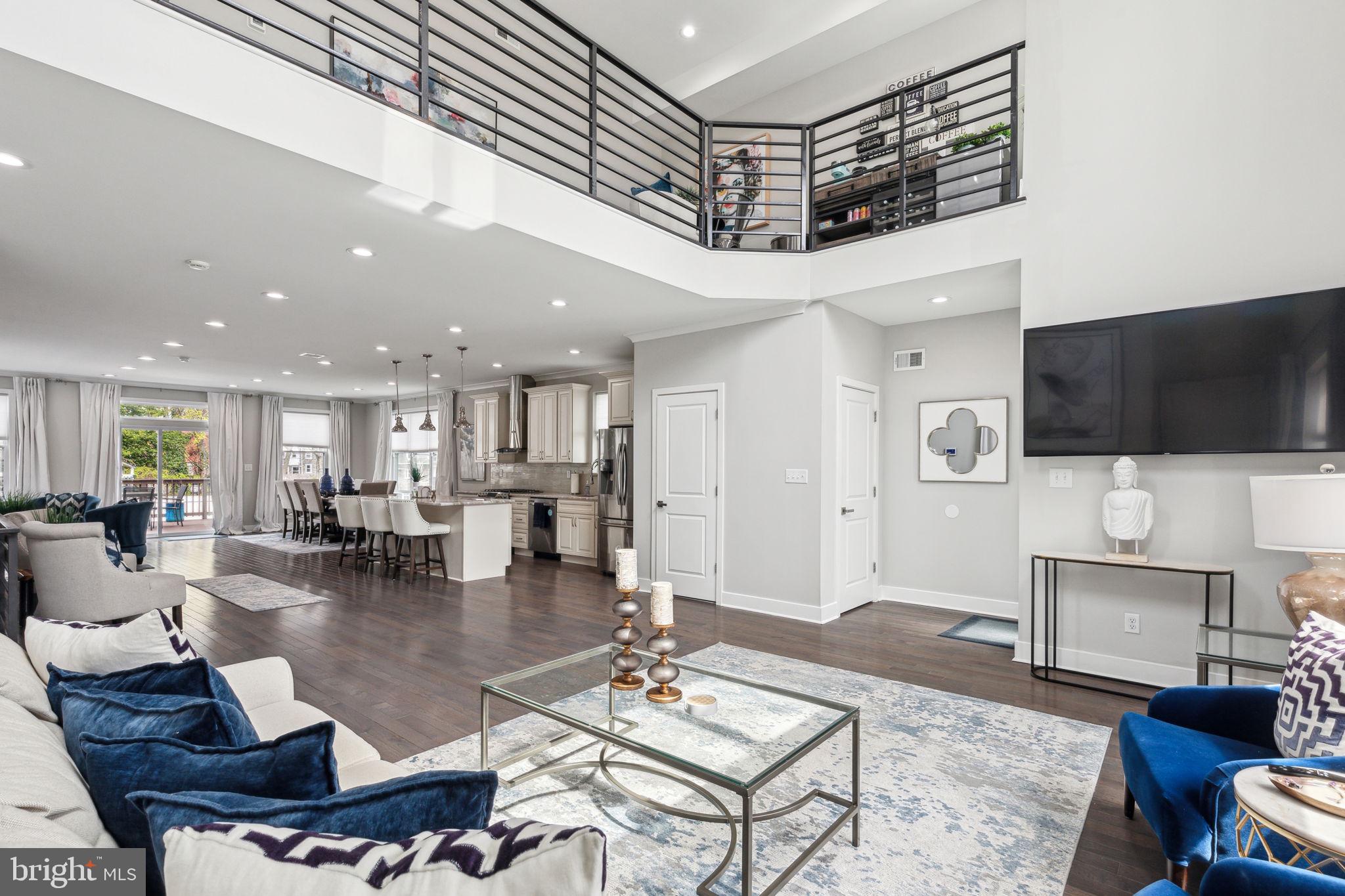 a living room with fireplace furniture and a flat screen tv